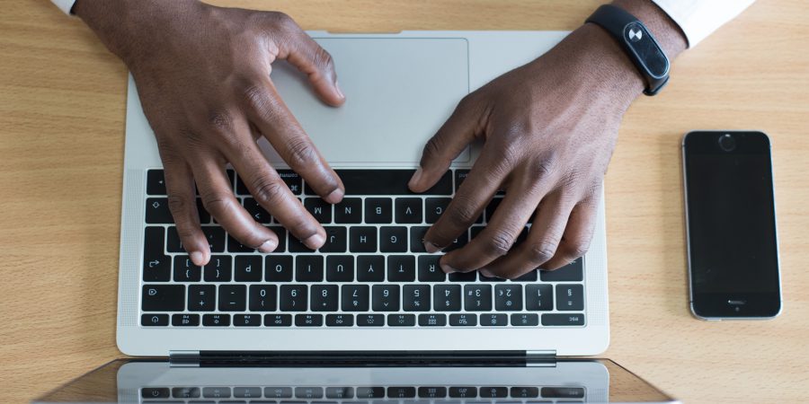 A top-down view of someone writing on a keyboard