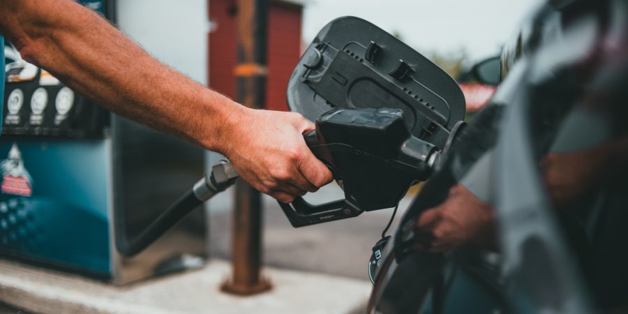 filling up at the station to get more out of a tank of gas