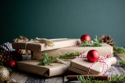 A pile of gifts wrapped in brown paper and string