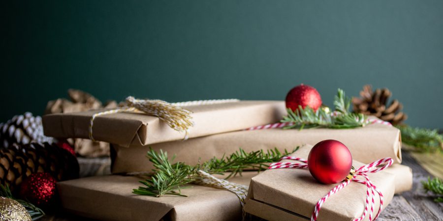 A pile of gifts wrapped in brown paper and string