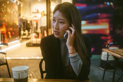 A woman speaking to a telemarketer on the phone