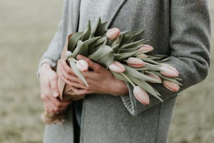 A woman holding flowers - 5 things to consider when making end-of-life decisions