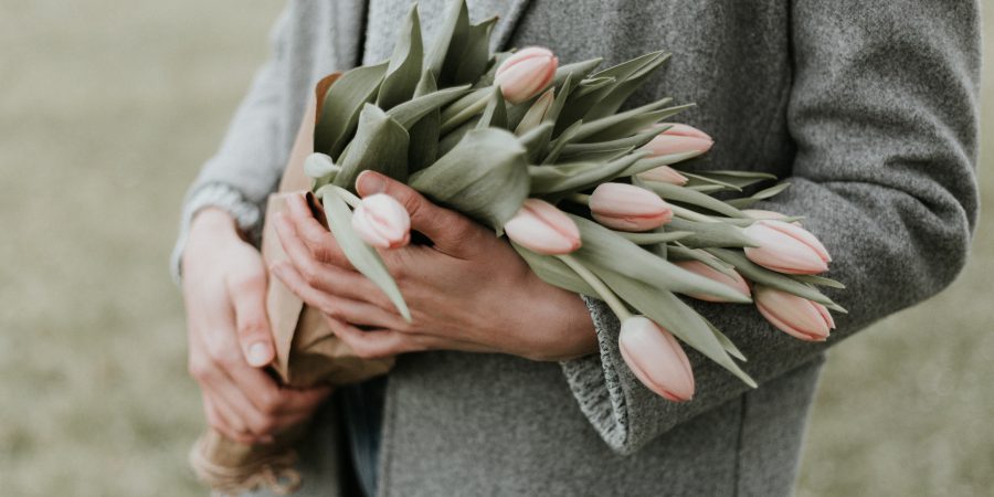 A woman holding flowers - 5 things to consider when making end-of-life decisions