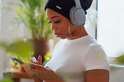 woman looking at her phone - BC regulator helps consumer out of unlawful contract